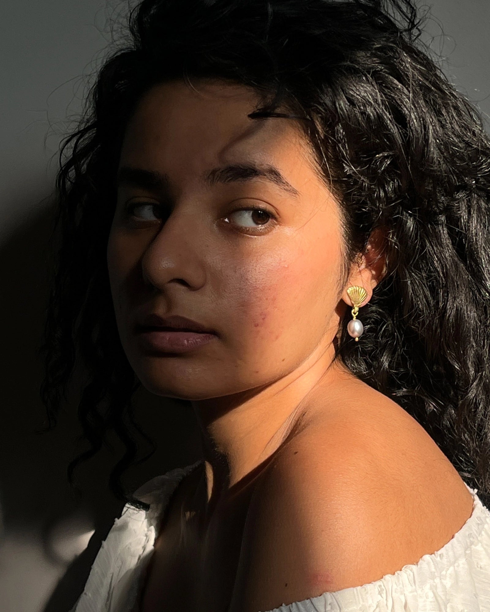 Gold Plated Seashell Pearl earrings with a grey fresh water pearl drop handmade by A Creator's Studio