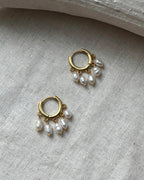 gold plated White lustrous freshwater pearl chandelier earrings with multiple freshwater pearl drops handmade by A Creator's Studio