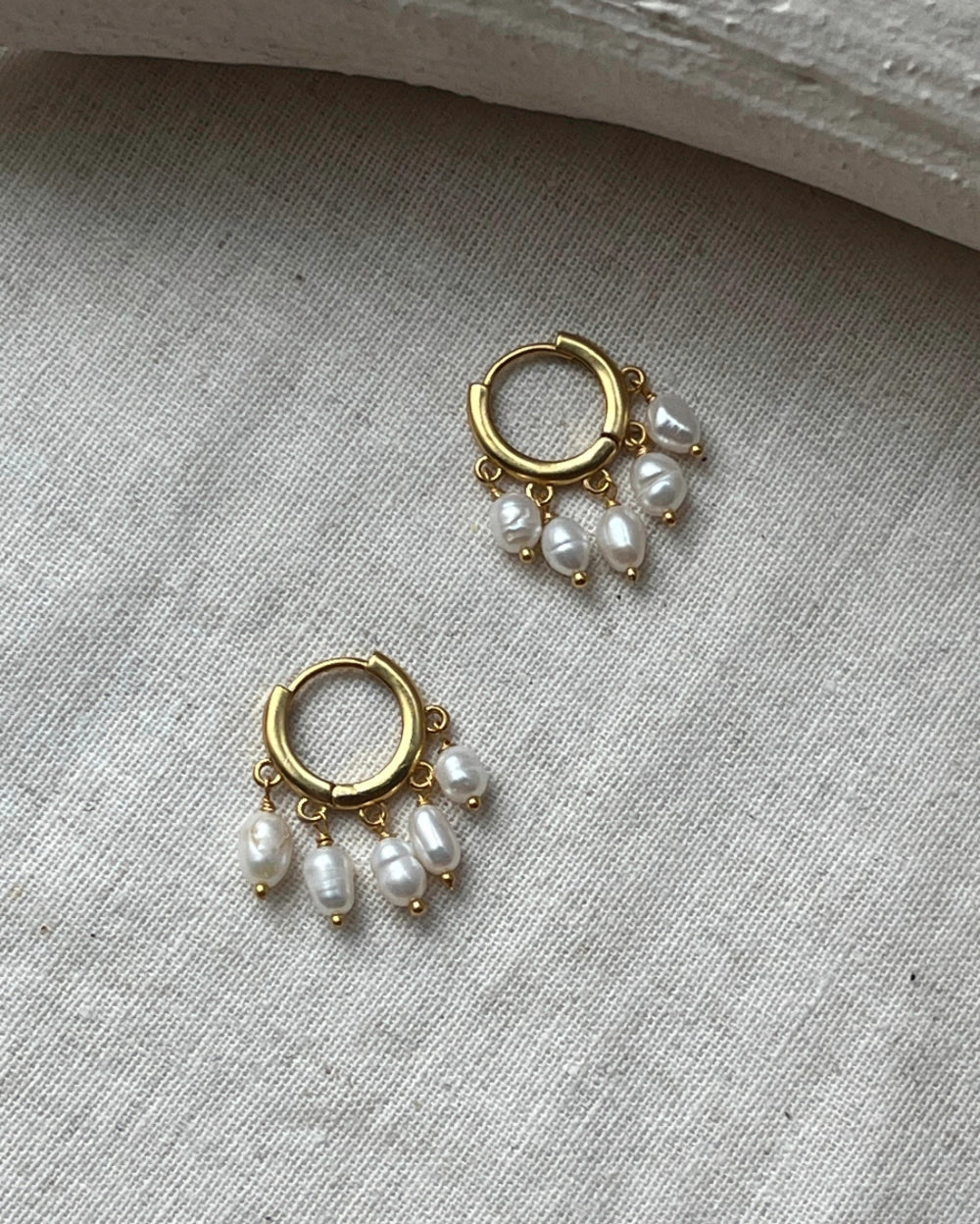 gold plated White lustrous freshwater pearl chandelier earrings with multiple freshwater pearl drops handmade by A Creator's Studio