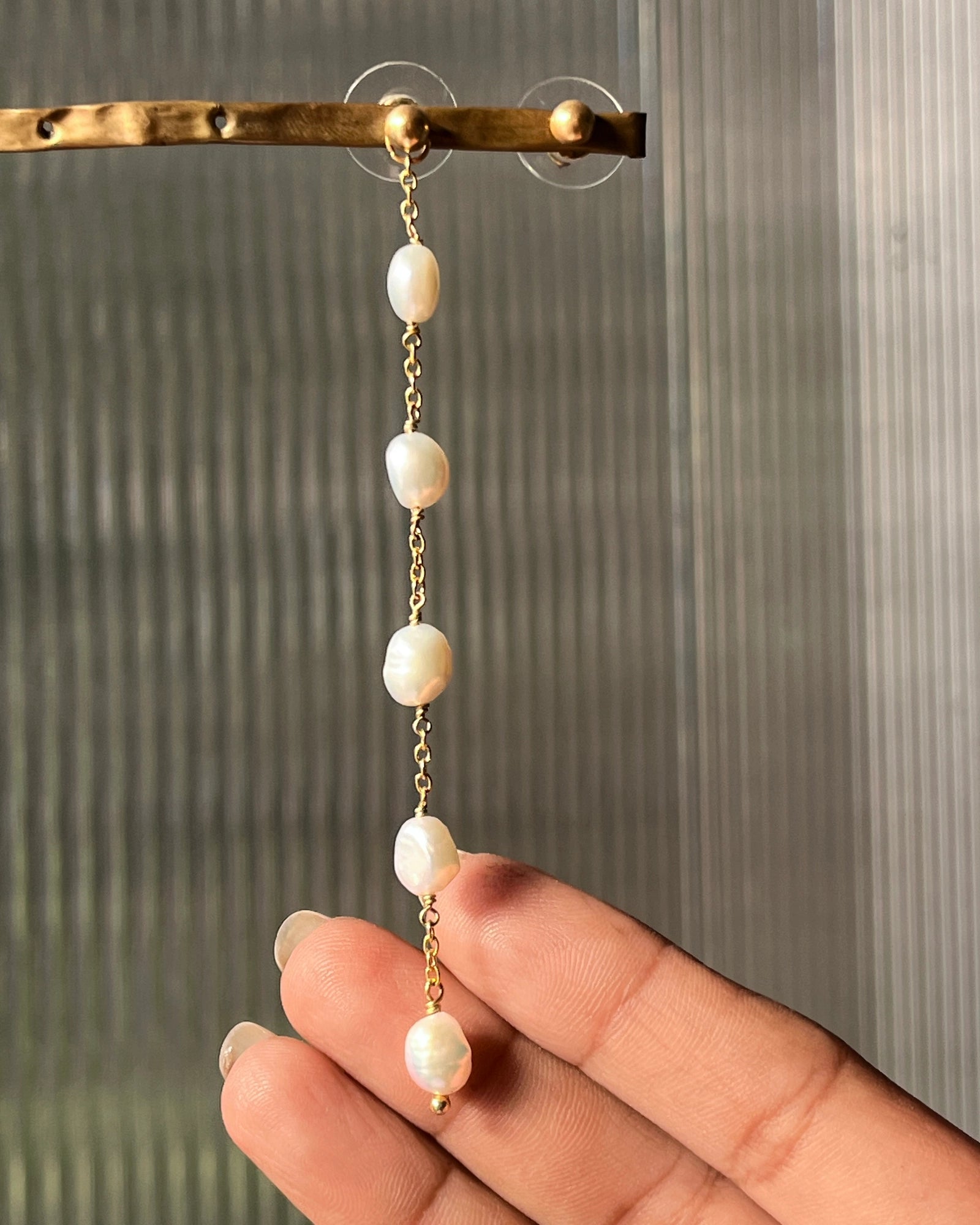 Gold Plated white pearl dangle earrings with multiple freshwater pearl links handmade by A Creator's Studio