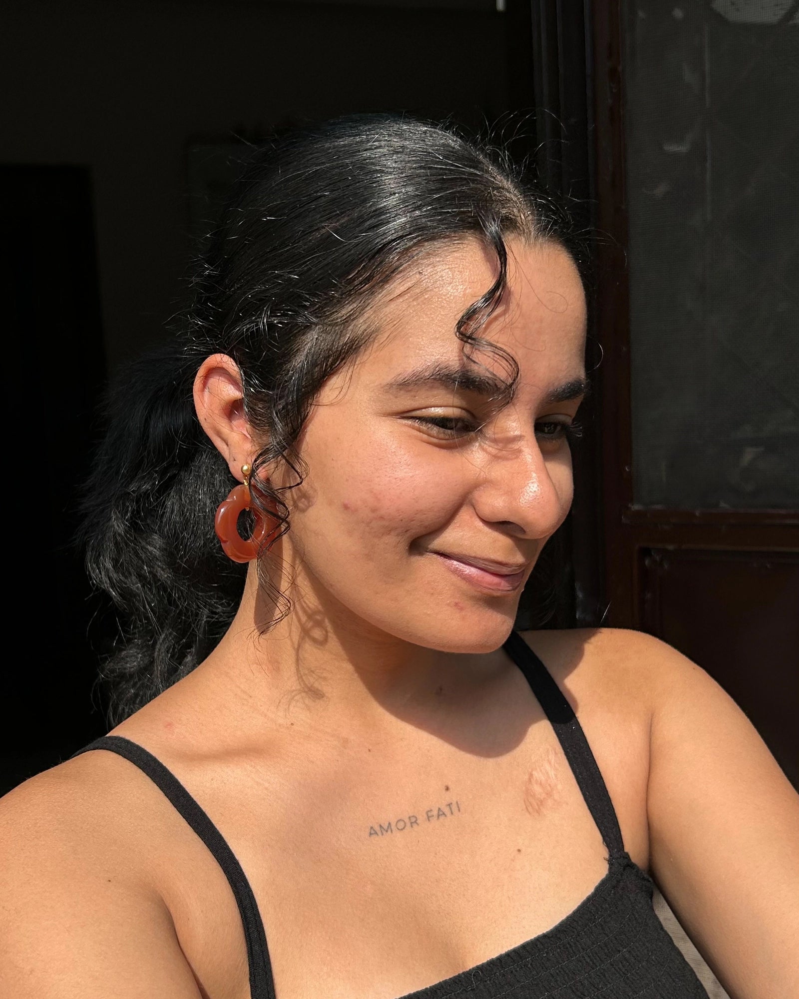 gold plated Carved Carnelian floral earrings with a carnelian flower drop handmade by A Creator's Studio