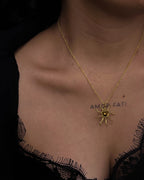 Brass wired sun necklace with a crystal in the centre handmade by A Creator's Studio