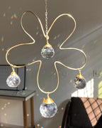 Wired flower suncatcher with clear crystals handmade by A Creator's Studio