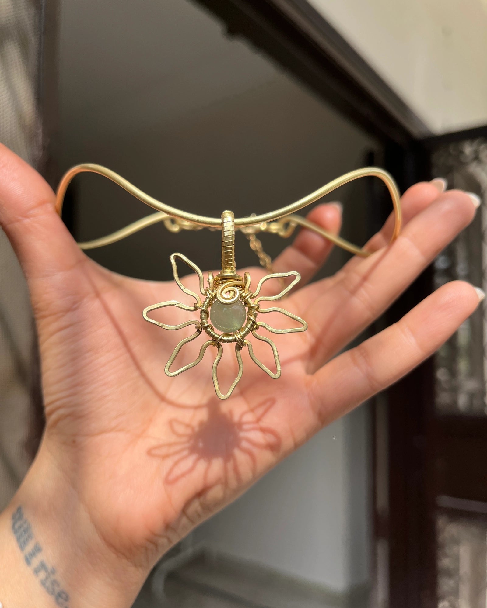 Brass wired sunflower choker with gemstone in the centre handmade by A Creator's Studio