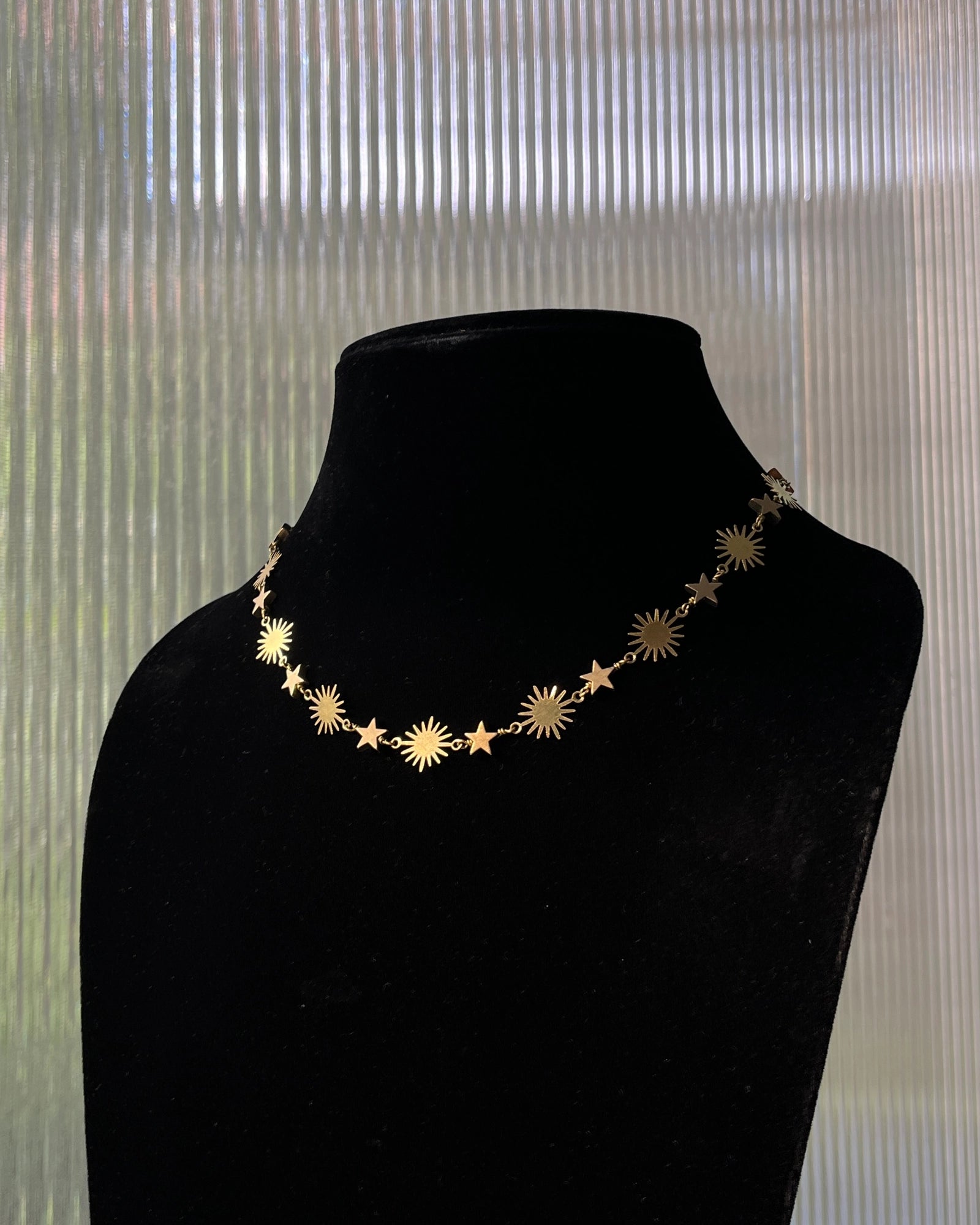 Brass star and sun link necklace with stars and suns linked together handmade by A Creator's Studio