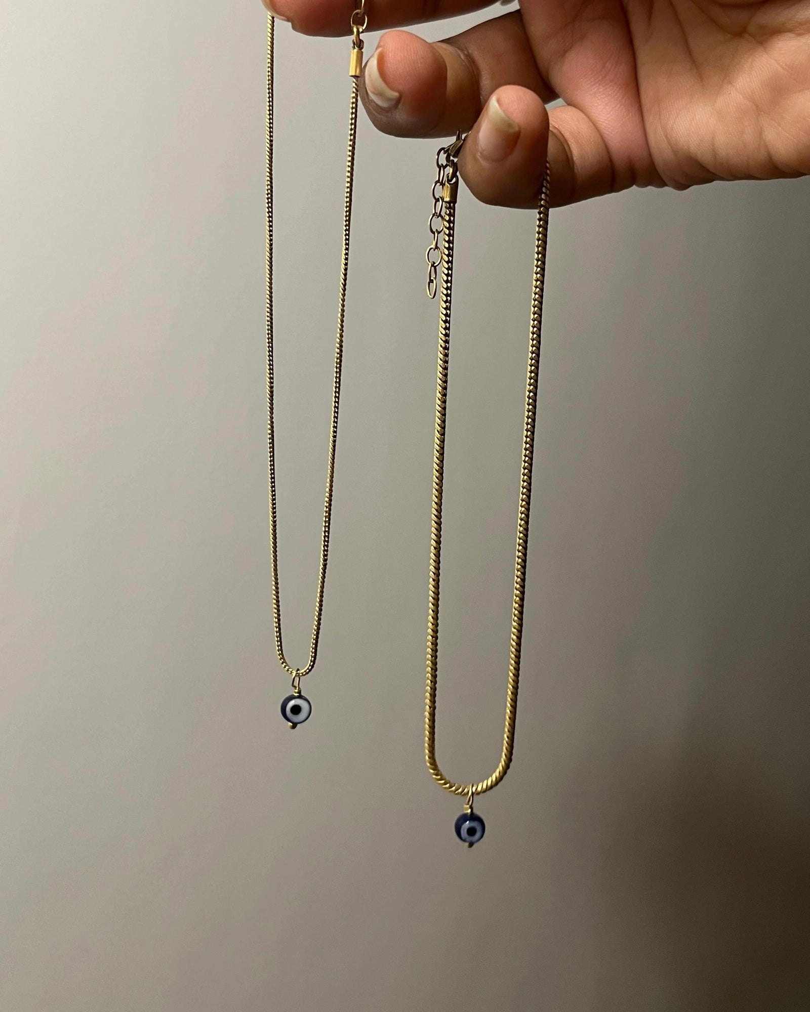 Brass evil eye anklet with an evil eye bead drop handmade by A Creator's Studio