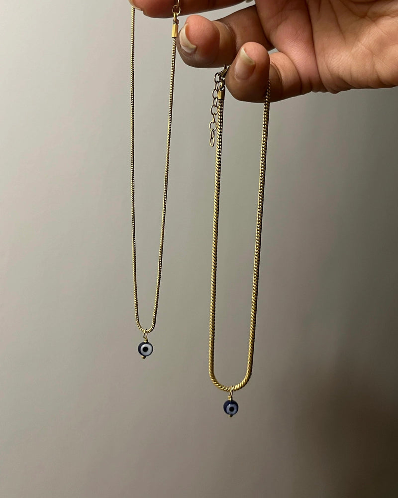 Brass evil eye anklet with an evil eye bead drop handmade by A Creator's Studio