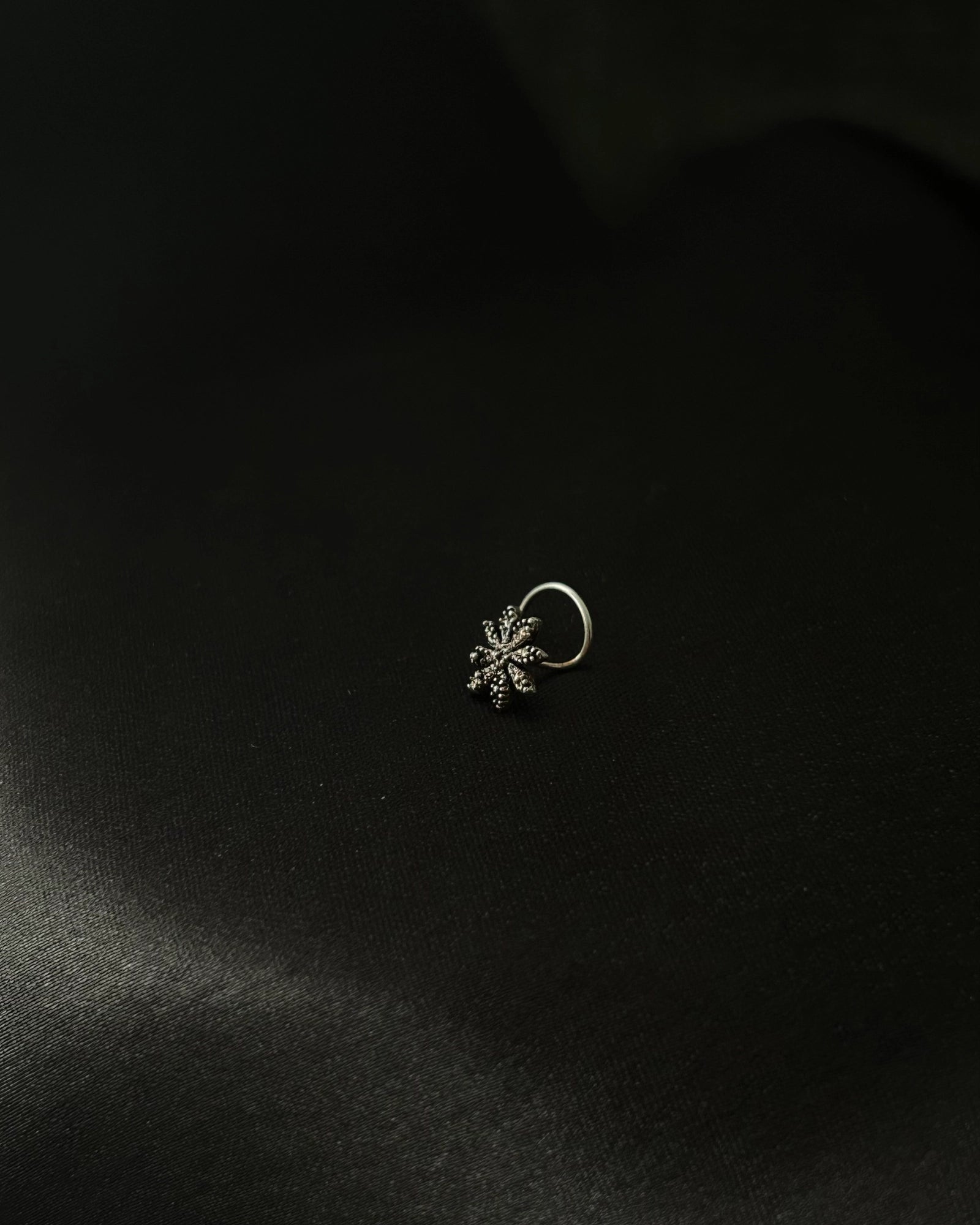 Silver oxidised star nose ring for pierced nose handmade by A Creator's Studio