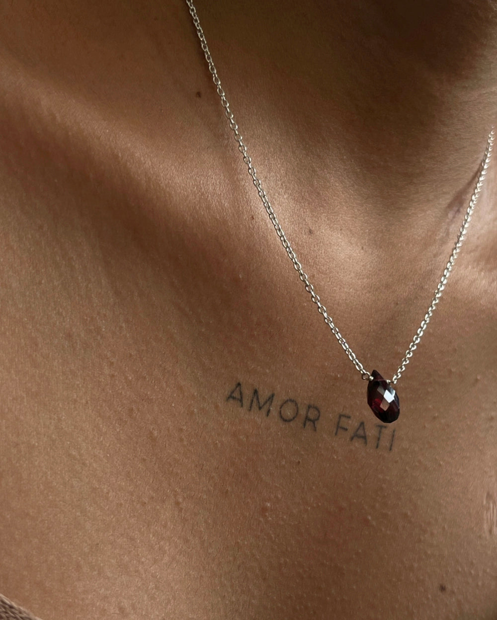 Dainty Silver Chain with a garnet drop pendant handmade by A Creator's Studio 