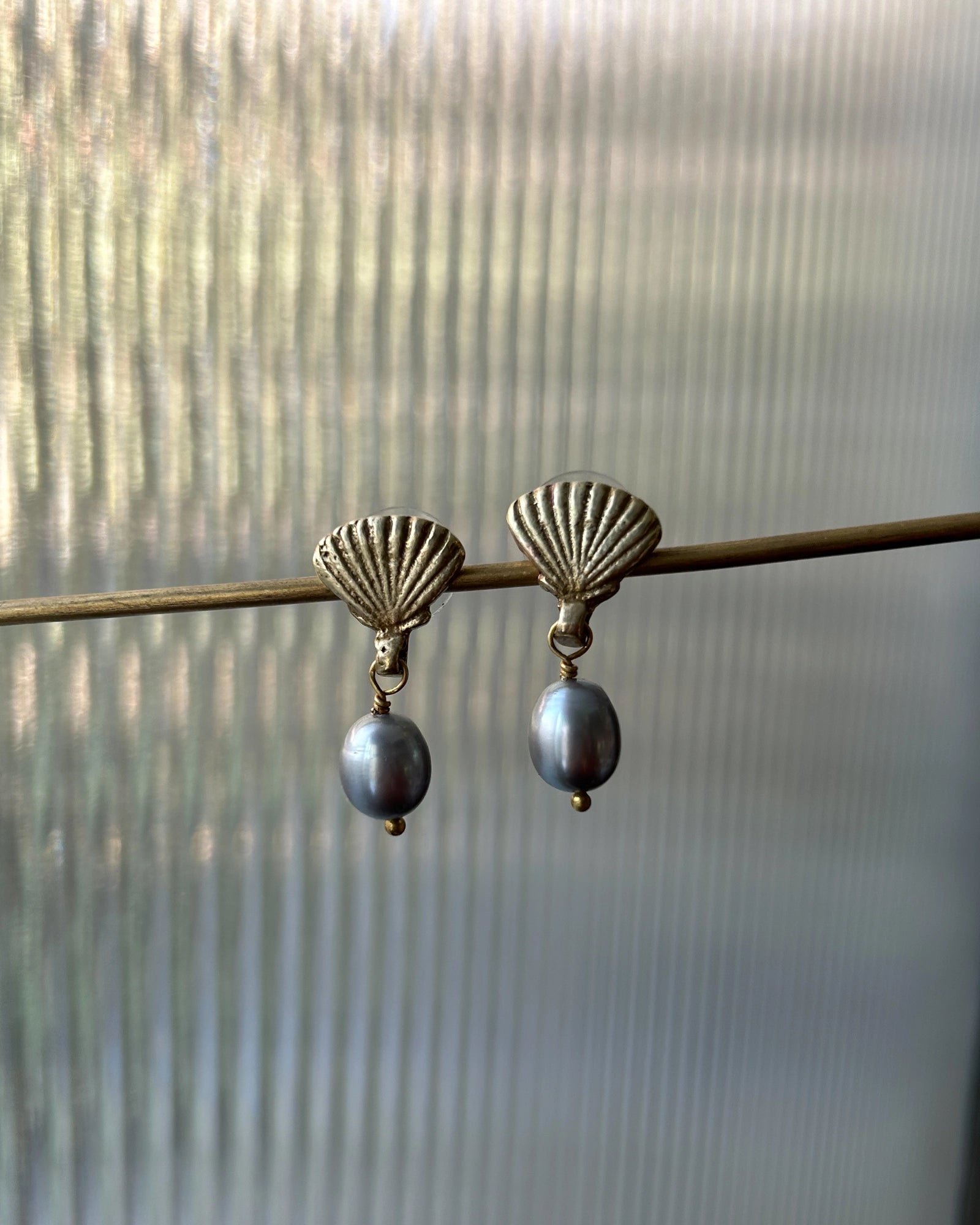 Gold Plated Seashell Pearl earrings with a grey fresh water pearl drop handmade by A Creator's Studio