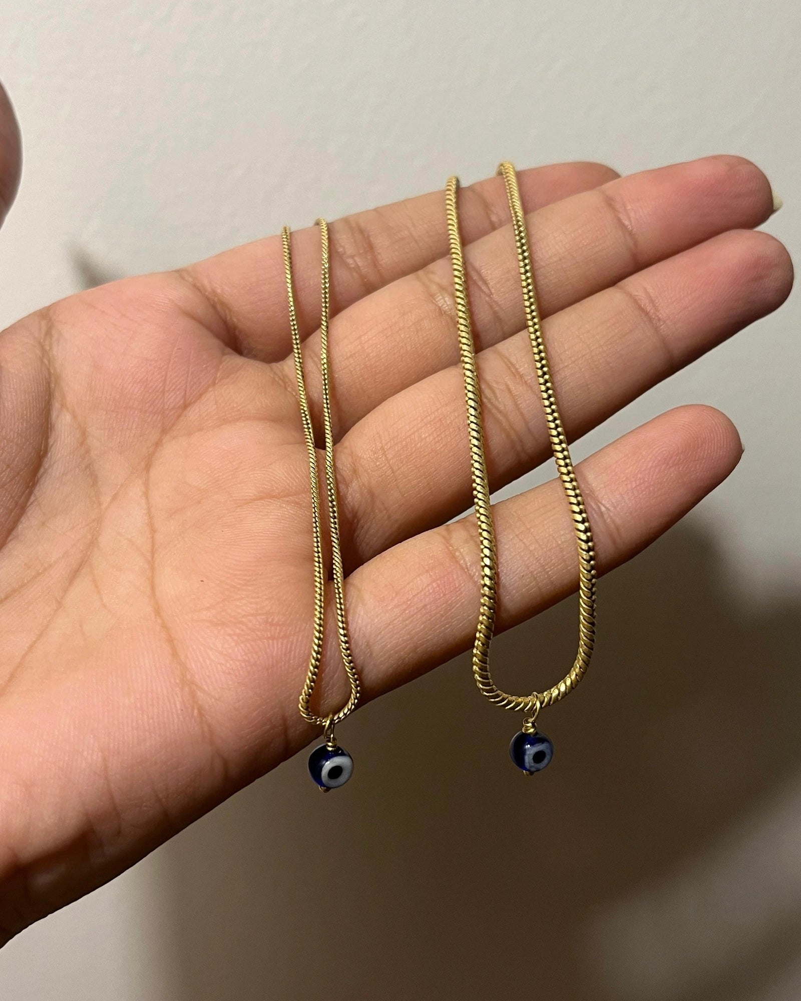 Brass evil eye anklet with an evil eye bead drop handmade by A Creator's Studio