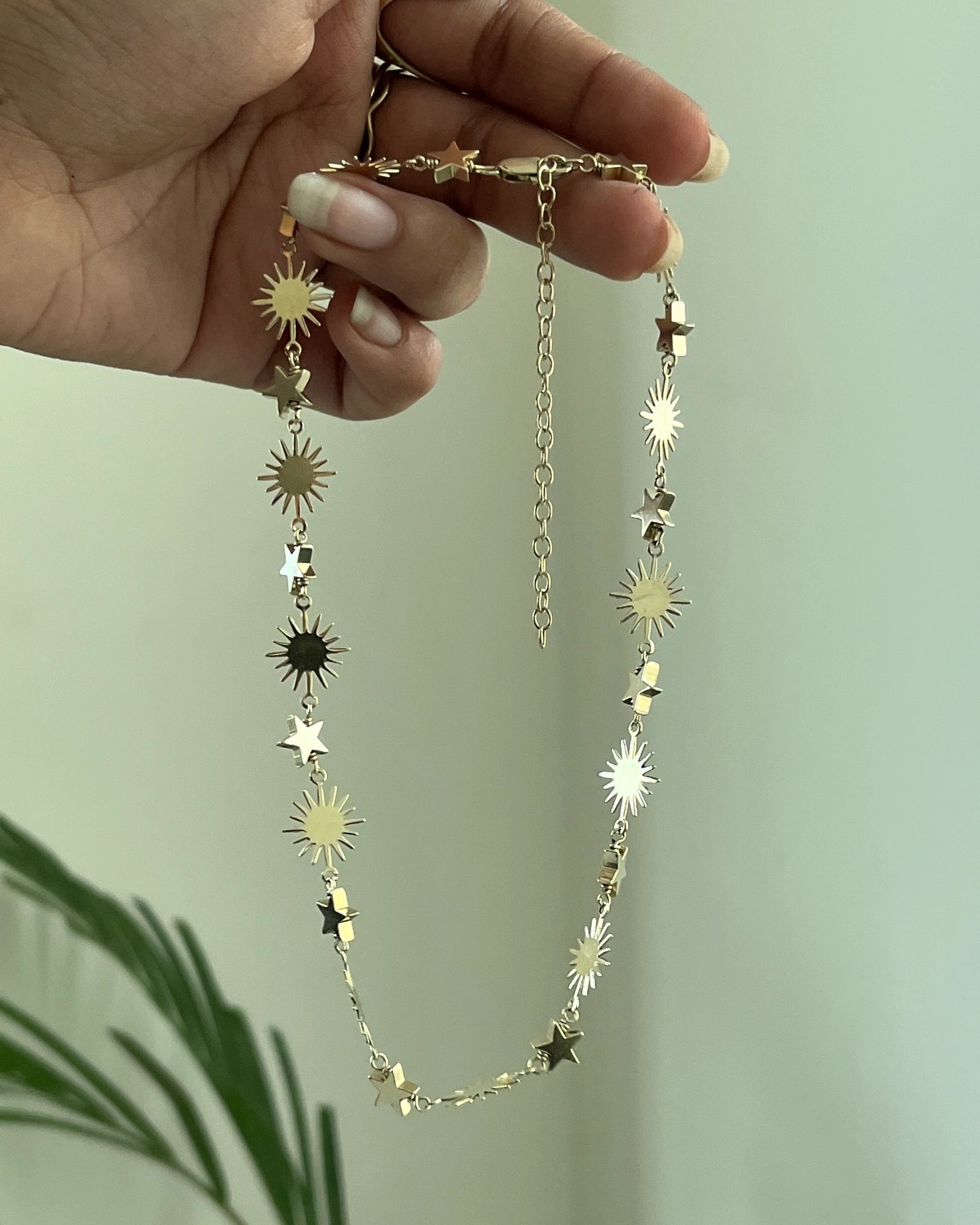 Brass star and sun link necklace with stars and suns linked together handmade by A Creator's Studio