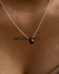 Dainty Silver Chain with a garnet drop pendant handmade by A Creator's Studio 