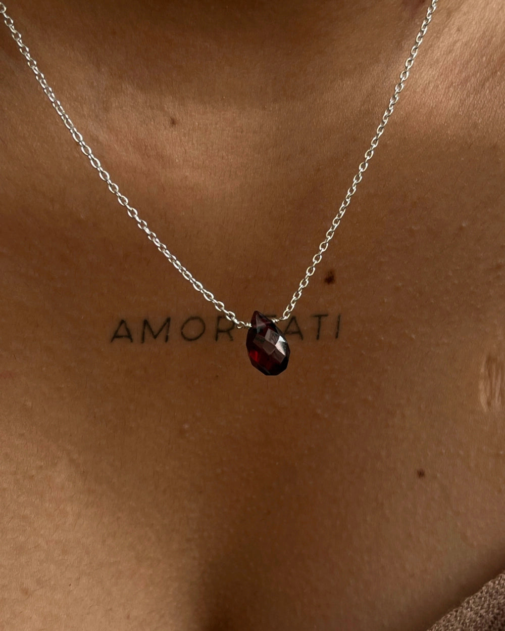 Dainty Silver Chain with a garnet drop pendant handmade by A Creator's Studio 