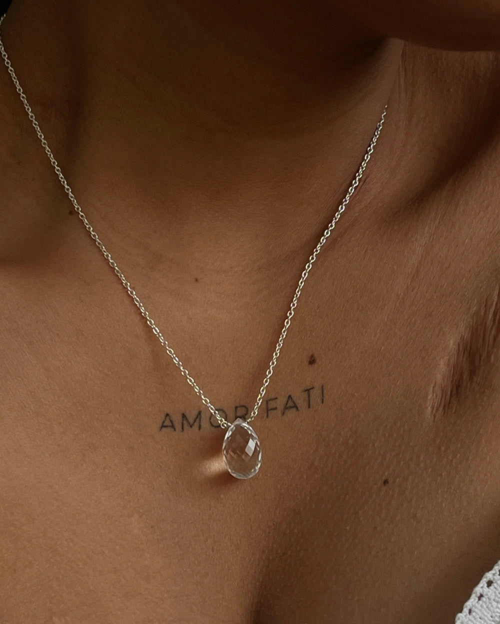 Dainty Silver Chain with a clear quartz drop pendant handmade by A Creator's Studio
