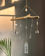 upcycled sun catcher with glass crystals, a wooden log base and a geode handmade by A Creator's Studio