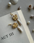 Gold plated dangle earrings with a flower charm and a freshwater pearl drop handmade by A Creator's Studio