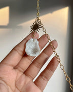 upcycled sun catcher with glass crystals, a wooden log base and a geode handmade by A Creator's Studio