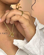 Brass necklace with a balloon dog pendant handmade by A Creator's Studio