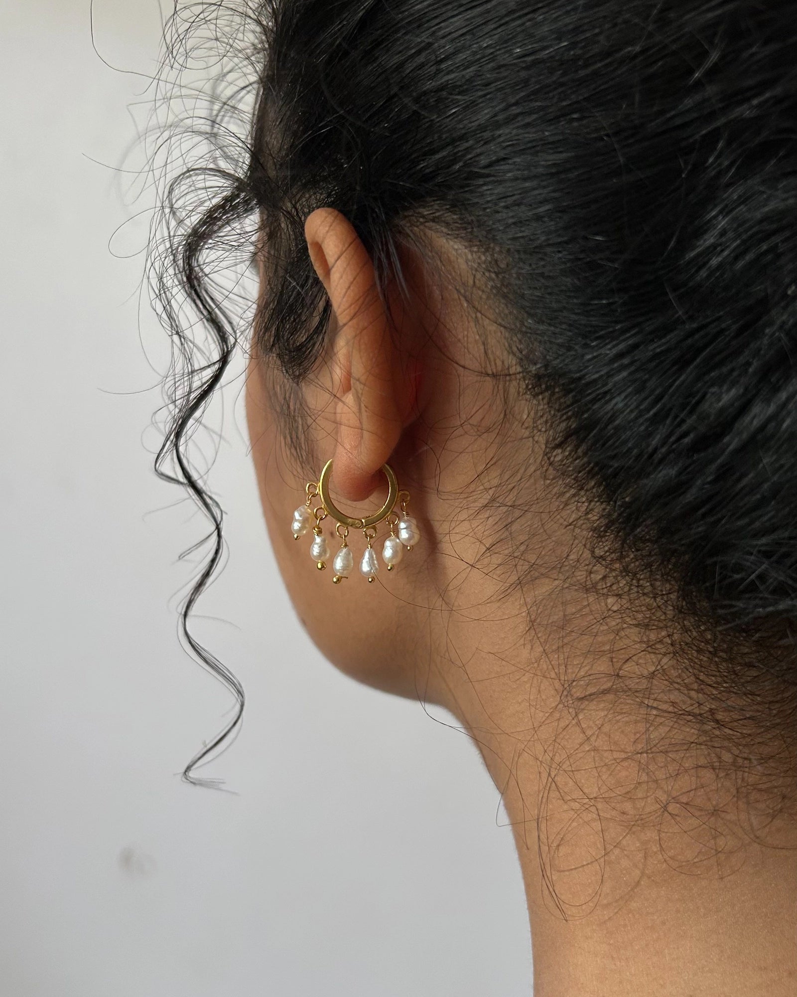 gold plated White lustrous freshwater pearl chandelier earrings with multiple freshwater pearl drops handmade by A Creator's Studio