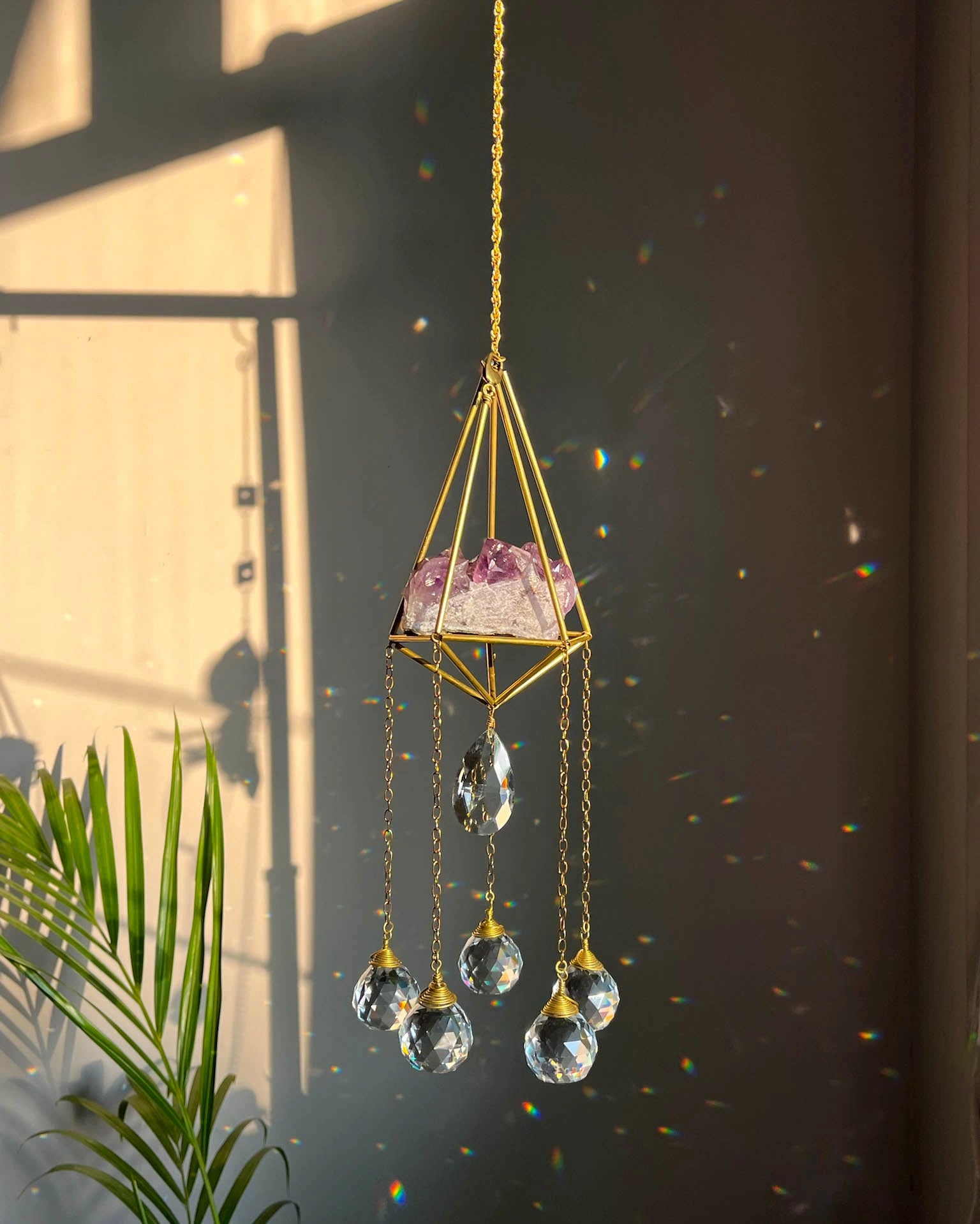 Amethyst Crystal sun catcher with an amethyst cluster in a 3d wired frame and glass crystal drops, handmade by A Creator's Studio