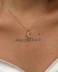 Brass necklace with a crescent moon pendant handmade by A Creator's Studio