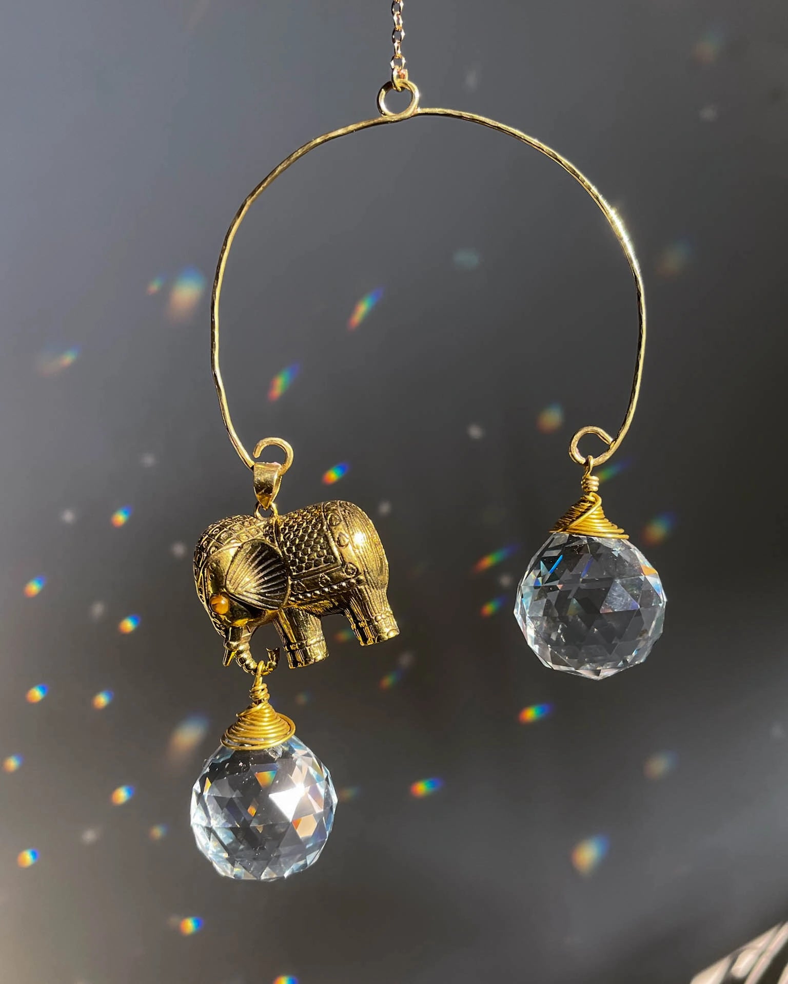 Elephant sun catcher with glass crystal drops and a tiger eye gemstone, handmade by A Creator's Studio