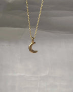 Brass necklace with a crescent moon pendant handmade by A Creator's Studio
