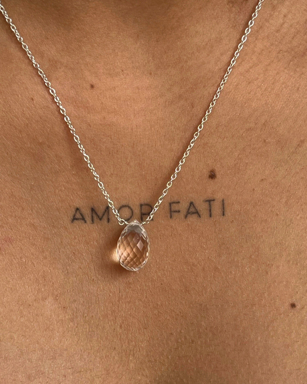 Dainty Silver Chain with a clear quartz drop pendant handmade by A Creator's Studio