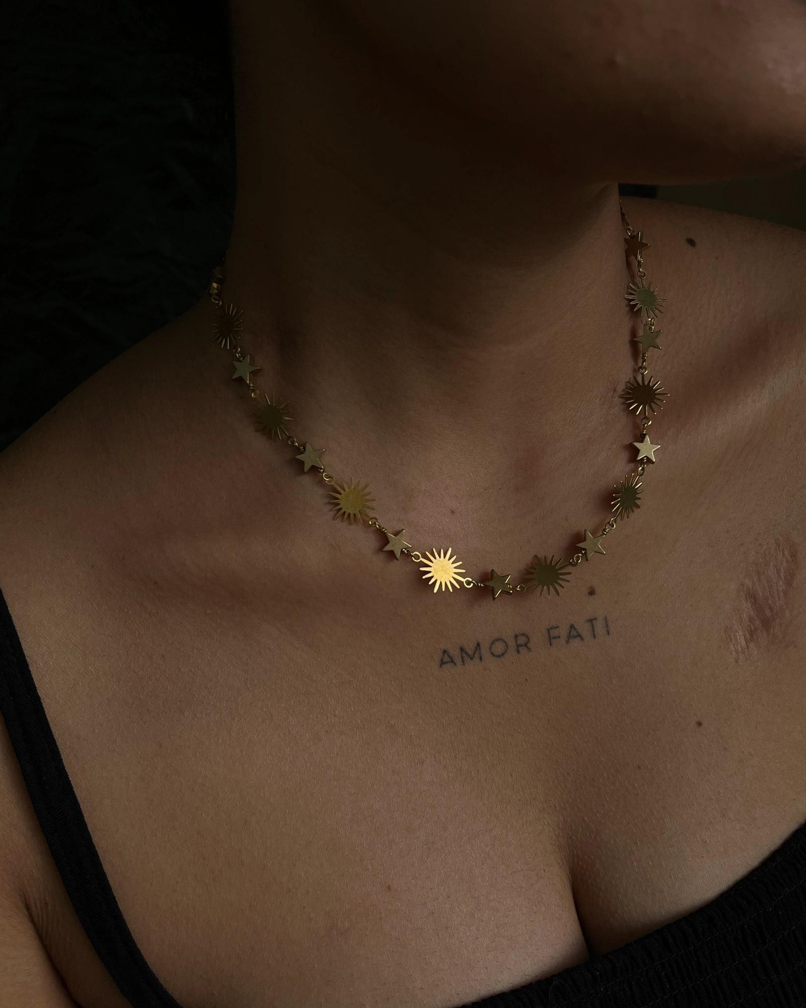 Brass star and sun link necklace with stars and suns linked together handmade by A Creator's Studio