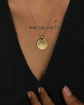 Brass necklace with a hammer texture coin pendant handmade by A Creator's Studio