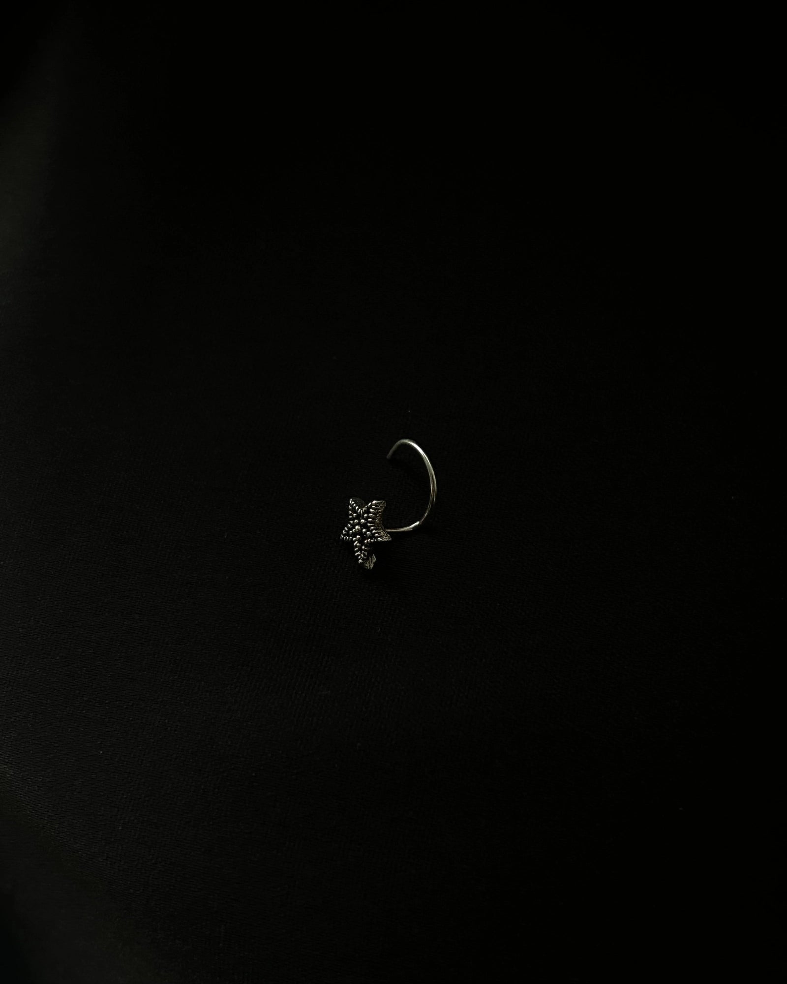 Silver oxidised star nose ring for pierced nose handmade by A Creator's Studio