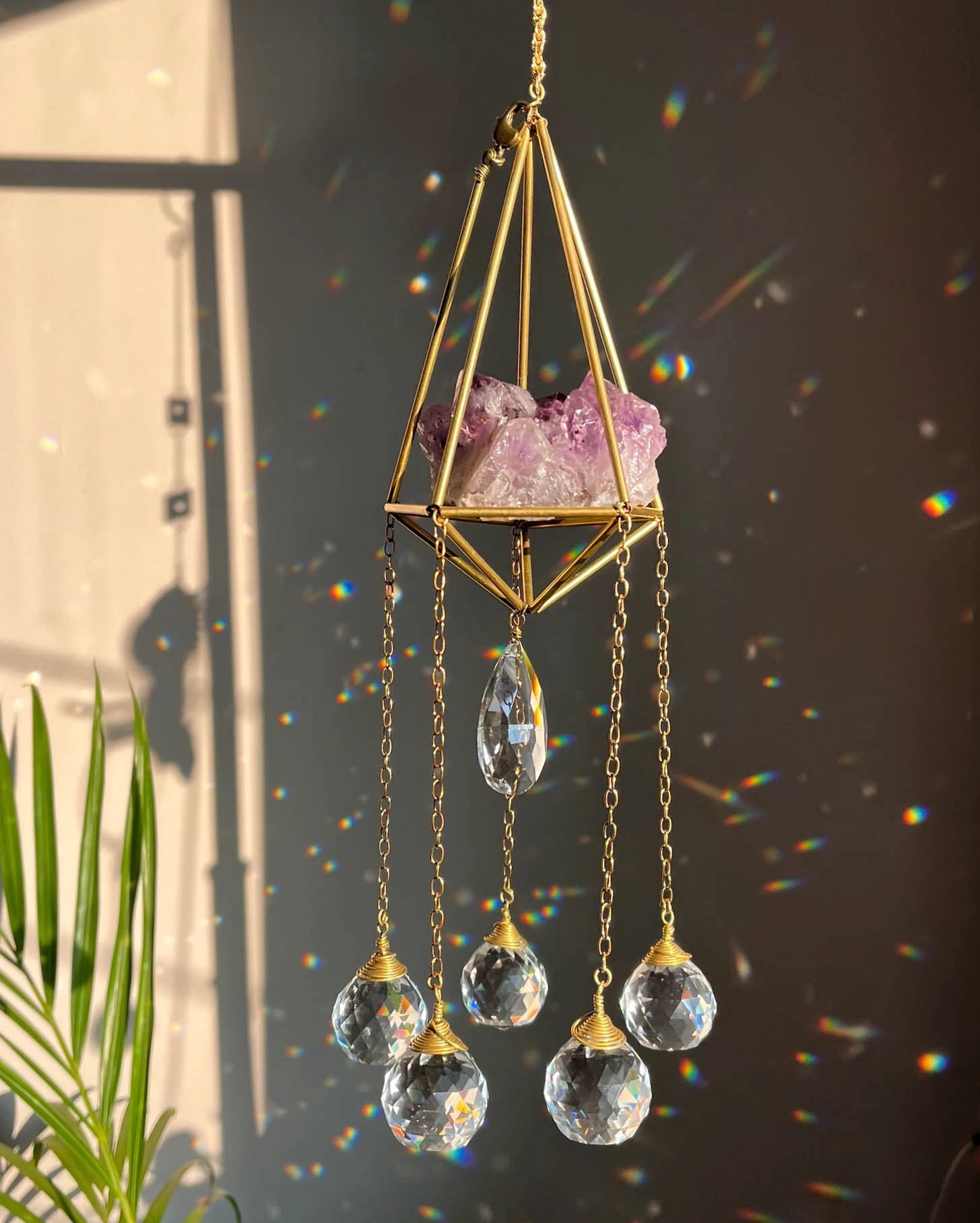Amethyst Crystal sun catcher with an amethyst cluster in a 3d wired frame and glass crystal drops, handmade by A Creator's Studio