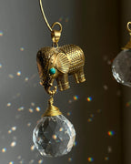 Elephant sun catcher with glass crystal drops and a turquoise gemstone, handmade by A Creator's Studio