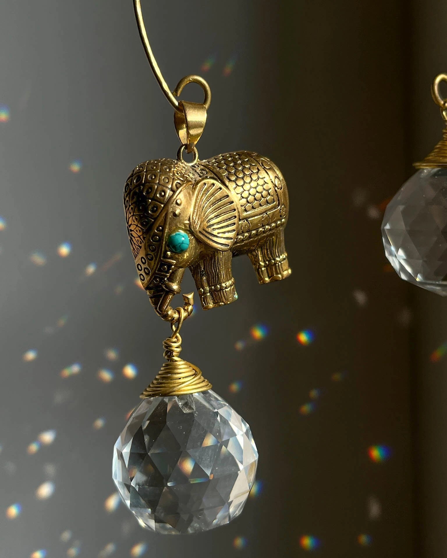 Elephant sun catcher with glass crystal drops and a turquoise gemstone, handmade by A Creator's Studio