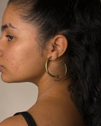 Brass snake hoop earrings handmade by A Creator's Studio