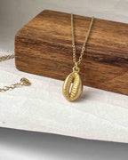 Brass necklace with a coffee bean pendant handmade by A Creator's Studio