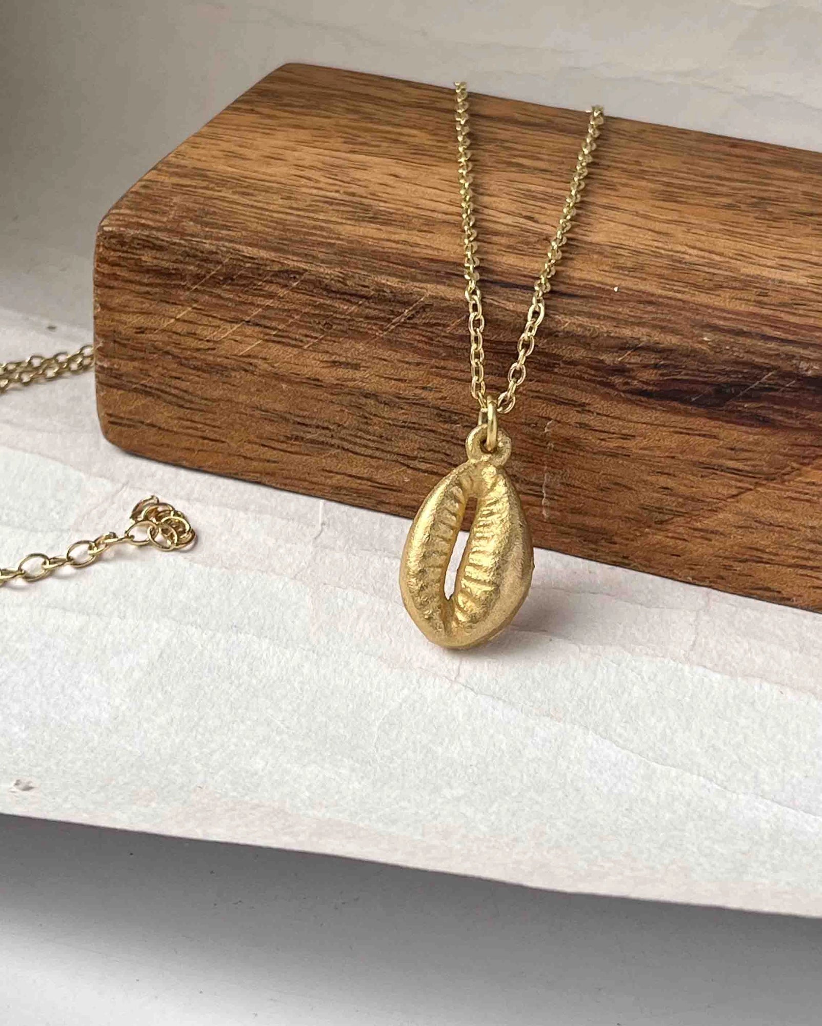 Brass necklace with a coffee bean pendant handmade by A Creator's Studio
