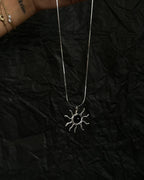 Sterling Silver Necklace with a wire wrapped sun pendant with a black onyx gemstone handmade by A Creator's Studio