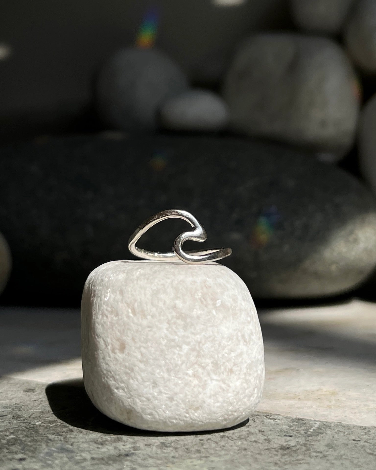 Silver ring with a wave in the centre handmade by A Creator's Studio