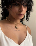 Brass wired crescent moon choker with emeralds and a chain handmade by A Creator's Studio