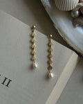 Gold Plated seashell dangle earrings with a fresh water pearl drop handmade by A Creator's Studio