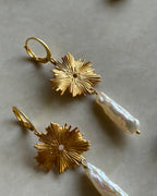 Gold plated dangle earrings with a flower charm and a freshwater pearl drop handmade by A Creator's Studio