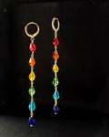 Rainbow-colored drop earrings handmade by a creator's studio