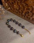 lustrous Black freshwater Pearl bracelet with gold plated chain and links handmade by A Creator's Studio