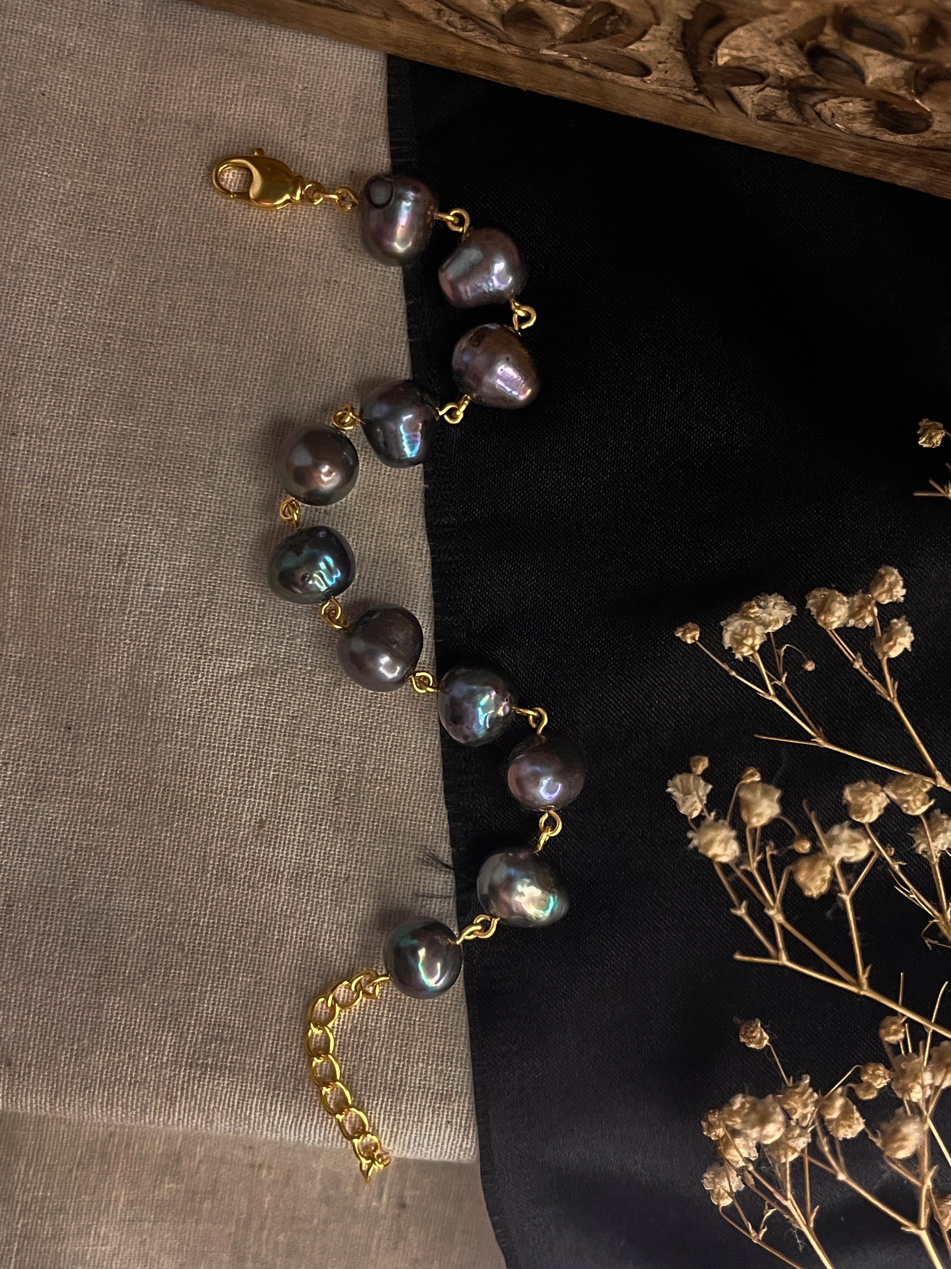 lustrous Black freshwater Pearl bracelet with gold plated chain and links handmade by A Creator's Studio
