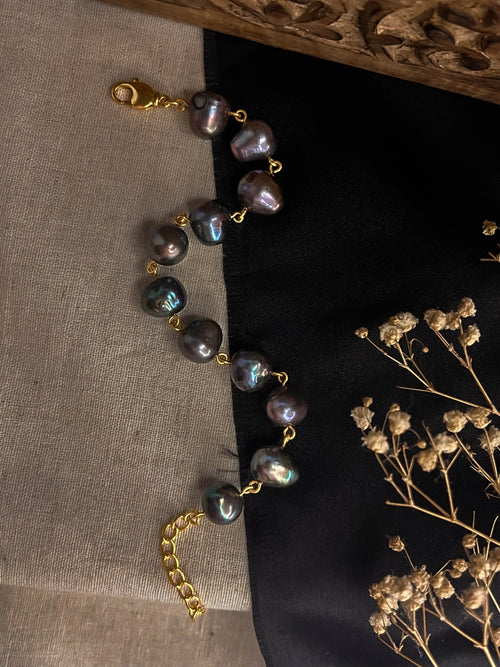 lustrous Black freshwater Pearl bracelet with gold plated chain and links handmade by A Creator's Studio