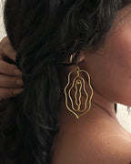 Brass earrings with unique vulva design handmade by A Creator's Studio