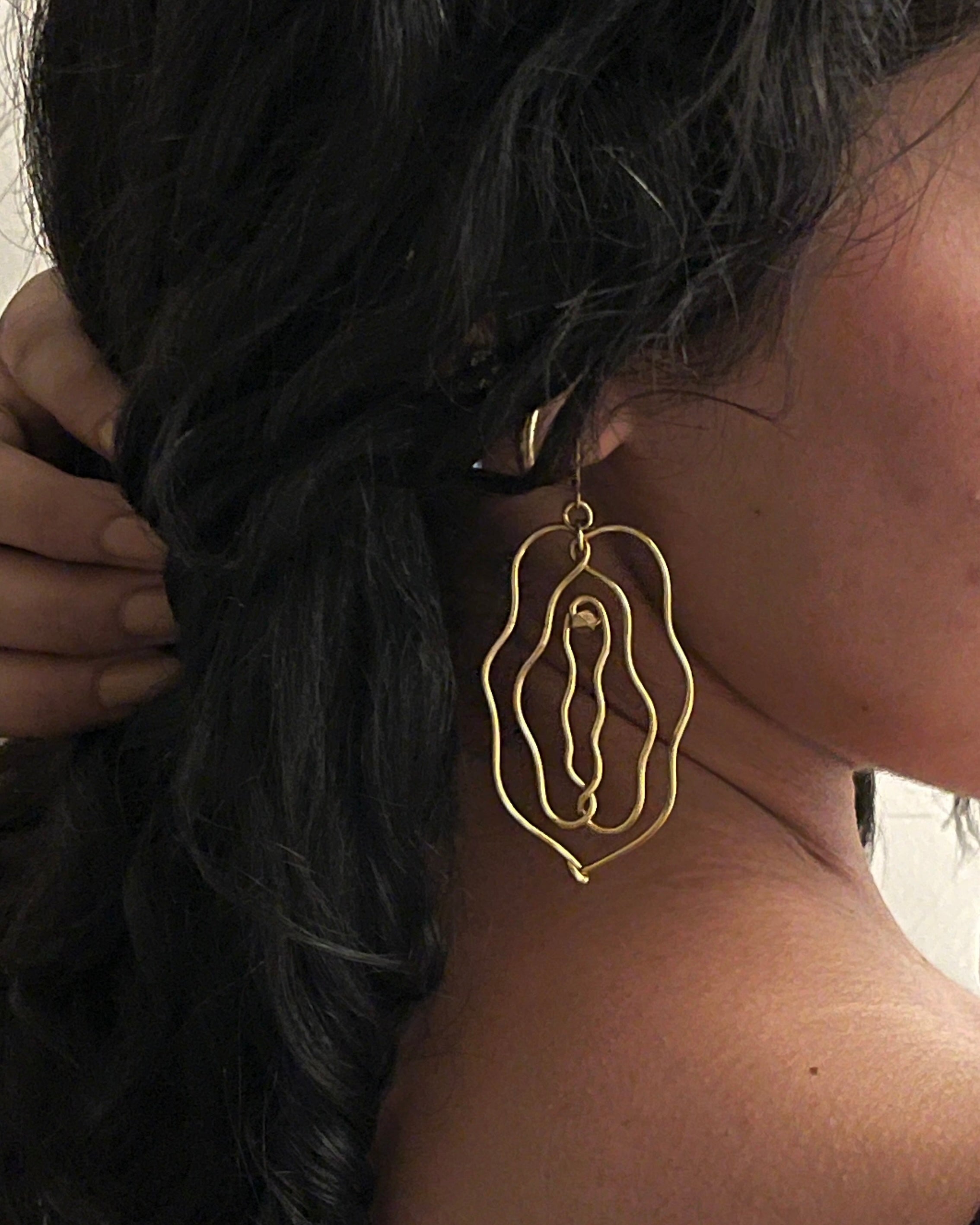 Brass earrings with unique vulva design handmade by A Creator's Studio