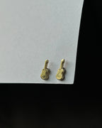 Brass guitar-shaped stud earrings handmade by A Creator's Studio